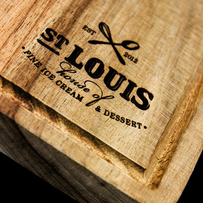 Wood burnishing on wooden chopping board, precise and detailed laser engraved logos and text