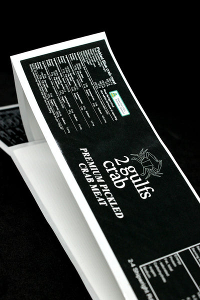 Jar lable stickers with white text on deep black background. Roll of stickers eady to peel off and apply to jars