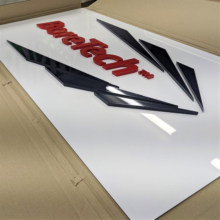 Raised acrylic sign on ACM for company wall signage