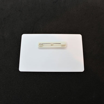 White ID tag with pin backing attachment