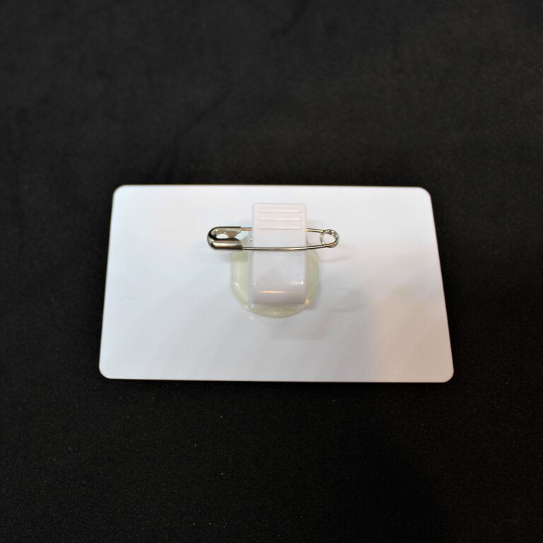 ID badge with rotating pin and clip attachment