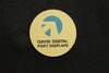 Brushed gold plastic circle badge with blue and black printed logo
